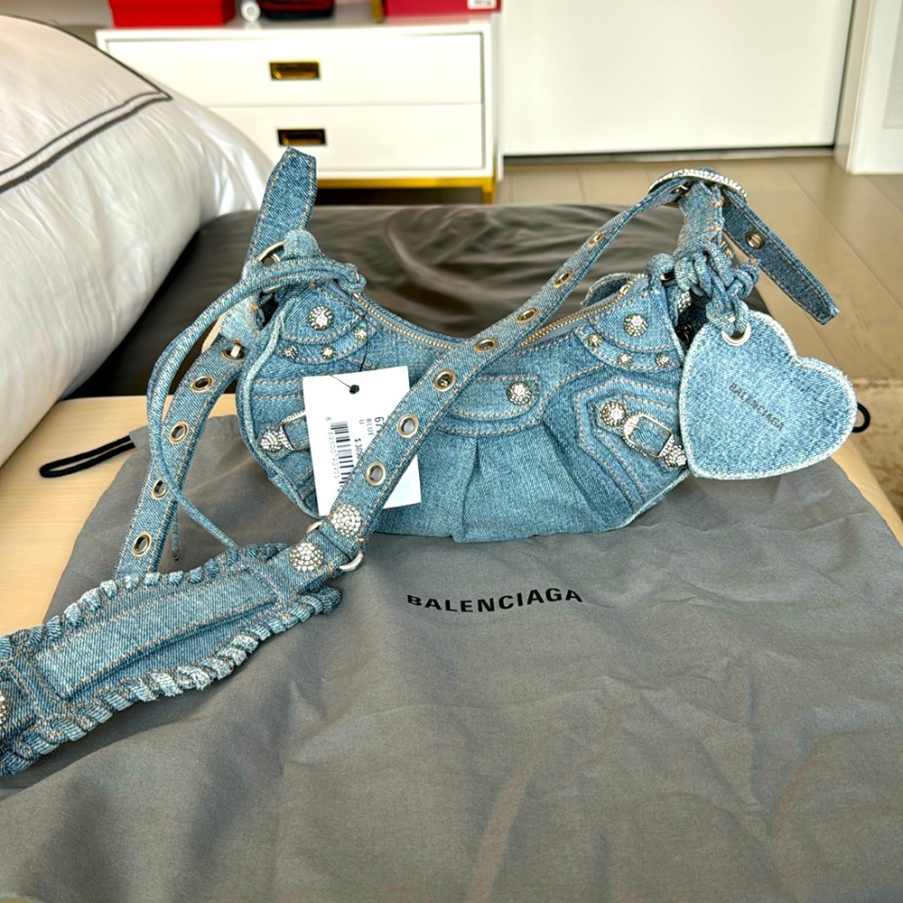 BALENCIAGA 
WOMEN'S LE CAGOLE XS SHOULDER BAG DENIM IN BLUE WITH CRYSTALS